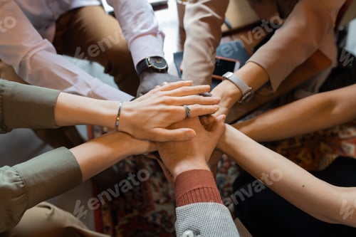 Preview: Pile of hands of several intercultural colleagues