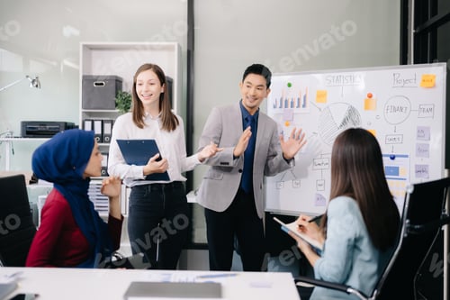Preview: Creative business people working on business project in office