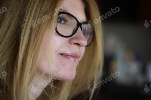 Preview: Woman with Blond Hair and Black Framed Glasses