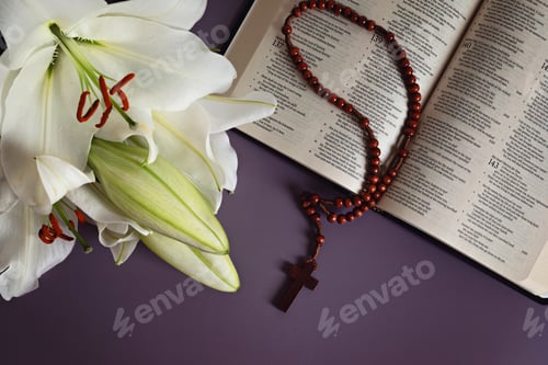 Preview: A symbolic Christian composition with Holy Bible lies beside fresh white lily