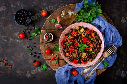 Preview: Stewed black beans with sweet peppers and tomatoes with spicy sauce in a pink bowl