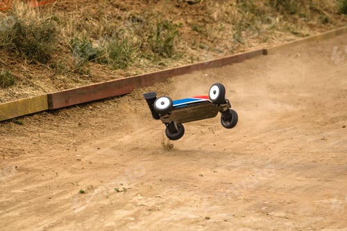 Preview: Radio controlled car model in race on dirt track