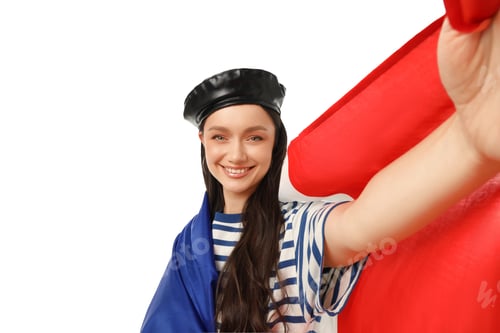 Preview: Woman in striped shirt waves flag, smiles, on white background
