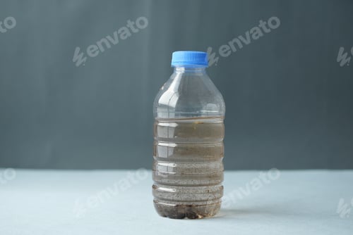 Preview: dirty bottle of water on table