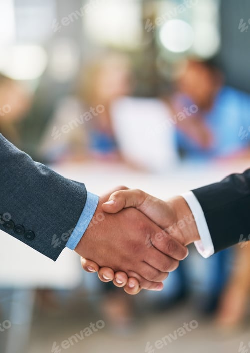 Preview: Merging together. Shot of businesspeople shaking hands.