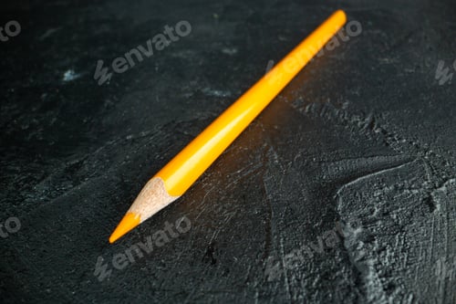 Preview: front view yellow pencil on dark background drawing pen color photo art school