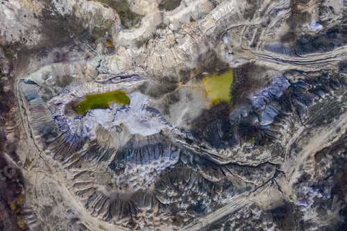 Preview: Abandoned industrial mining area. Drone view of opencast mine filled with water. Aerial shot
