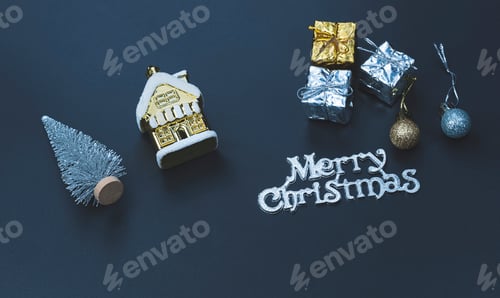 Preview: Silver and golden gift boxes with "merry Christmas" text on black board in blue night tone style