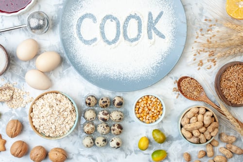 Preview: top view white flour inside plate with nuts seeds and eggs on white background nut dough bake food