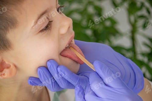 Preview: doctor looking into child's mouth, throat. pediatrician's appointment.