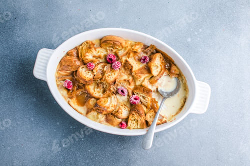 Preview: Croissant bread pudding with custard creamy sauce and vanilla ice cream very delicious dessert