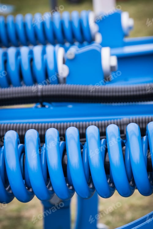 Preview: Steel blue spring as part of agricultural machine. Technology