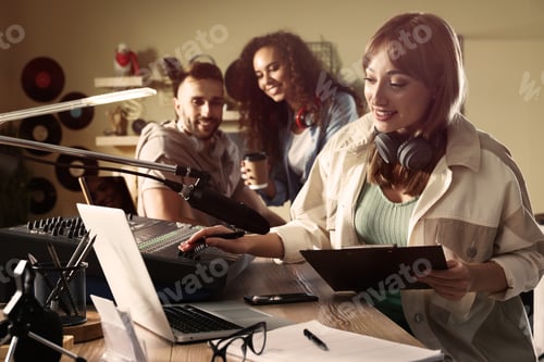 Preview: People working in modern radio studio with professional equipment