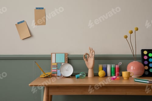 Preview: Creative composition of cozy office interior with wooden desk, armchair, mint lamp