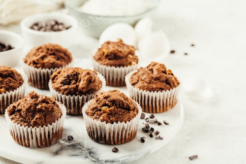 Preview: Freshly Baked Chocolate Chip Muffins on Marble Board