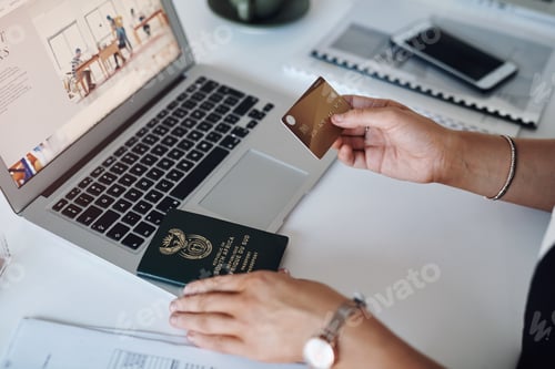 Preview: Cropped shop of an unrecognizable businesswoman using a credit card and laptop inside her laptop