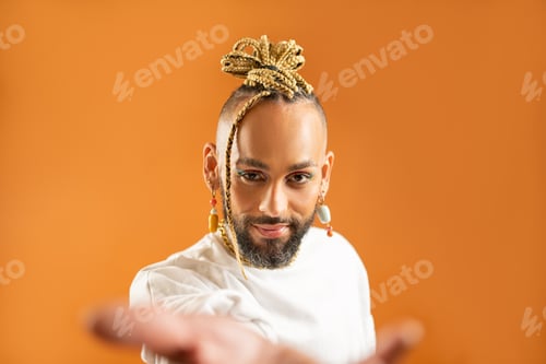 Preview: Black latin gay man outstretching empty hand towards camera