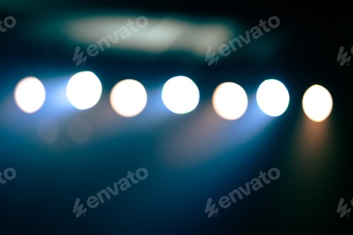 Preview: Blurred defocused flashlight effect and disco blue light party in the club at night
