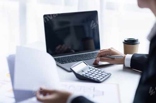 Preview: Asian female accountant or banker making calculations. Young business asian woman in workplace, D