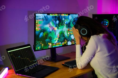 Preview: Game over you lose. Angry Asian gamer with gaming headphones playing video game on computer PC at