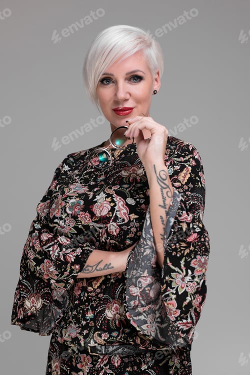Preview: Portrait of young blonde girl isolated on light background