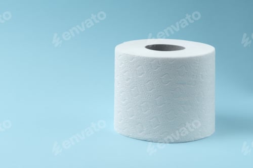 Preview: Toilet paper on blue background. Coronavirus panic concept. People are stocking up toilet paper for