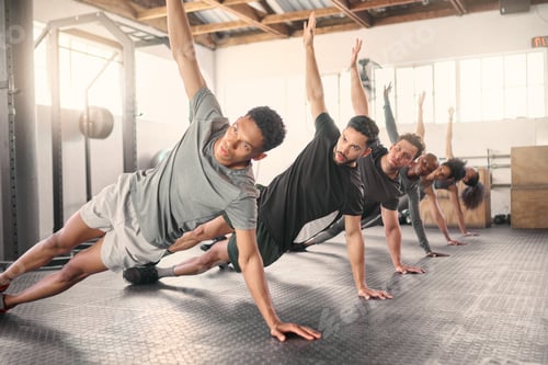 Preview: Fitness, exercise and training with a sports group stretching together in gym class for health or w