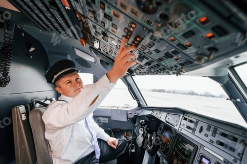 Preview: Control of the flight. Pilot on the work in the passenger airplane. Preparing for takeoff