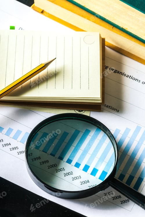 Preview: Magnifying glass and business growth graph