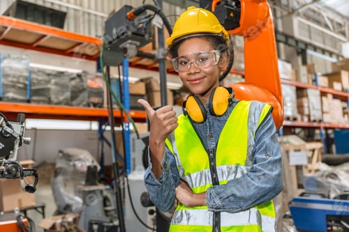 Preview: professional young engineer, technician work in modern factory industrial robot welding arm