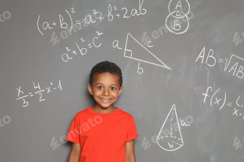 Preview: Little African-American school child and mathematical formulas on grey background