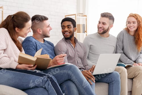 Preview: Group of multiethnic young students preparing for exams