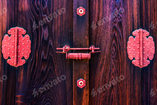 Preview: Detail of a traditional wooden door in a japanese temple, pink bolt and ornaments