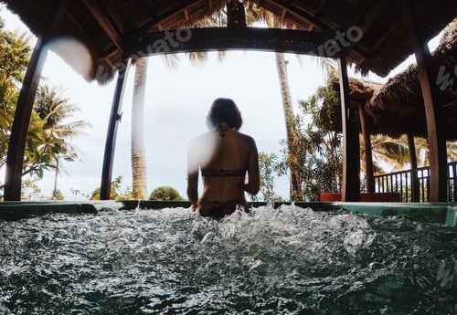 Preview: Woman in the outdoor jacuzzi.