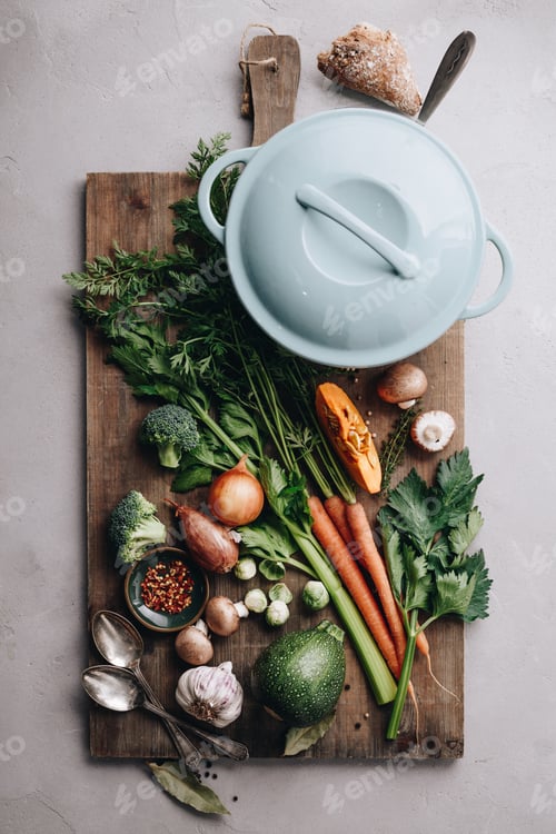 Preview: Cooking pot and various organic ingredients, top view