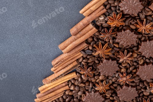 Preview: Food background. Coffee beans, cinnamon sticks, anise stars and chocolate candies.