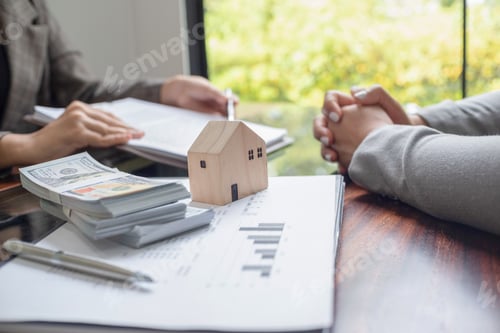 Preview: Real estate agent presenting and approved home loan contract.