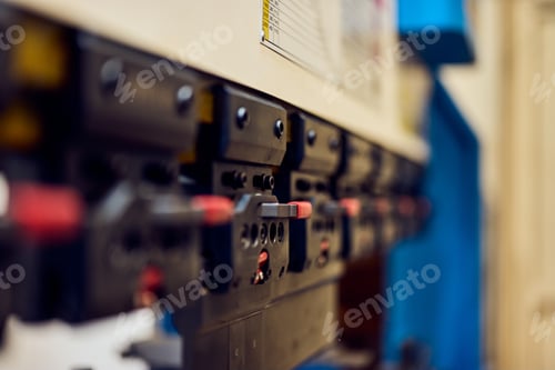 Preview: Close-Up of Industrial Machine Part Featuring Mechanical Components and Red Details