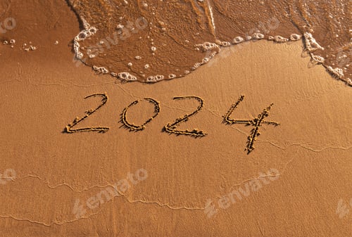 Preview: Hand-drawn numbers 2024 of new year on wet yellow sand on beach, copy space
