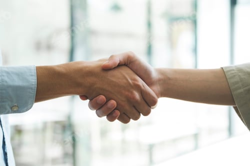 Preview: Businessmans handshake after good deal.