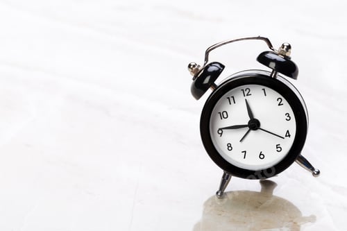Preview: black vintage alarm clock on color background