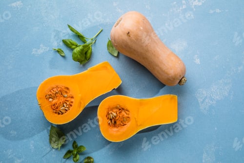 Preview: Butternut squash on the black table. Half cutted pumpkin squash with