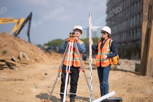 Preview: Construction surveyor or engineer working in pipe construction site