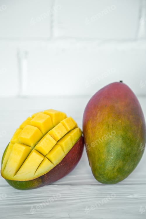 Preview: Mango on a white wooden background