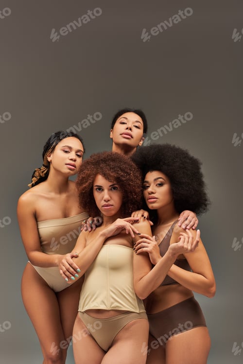 Preview: attractive young african american women in pastel underwear looking at camera, fashion concept