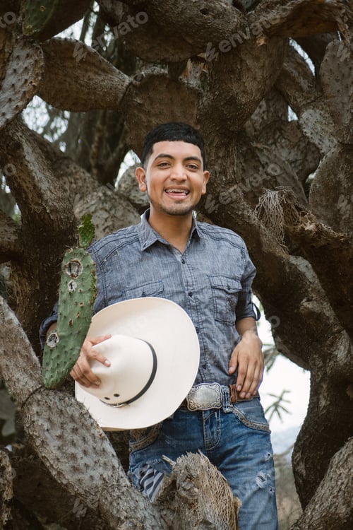 Preview: Smiling cowboy wearing a hat and sunglasses, enjoying outdoor adventures with a sense of fun