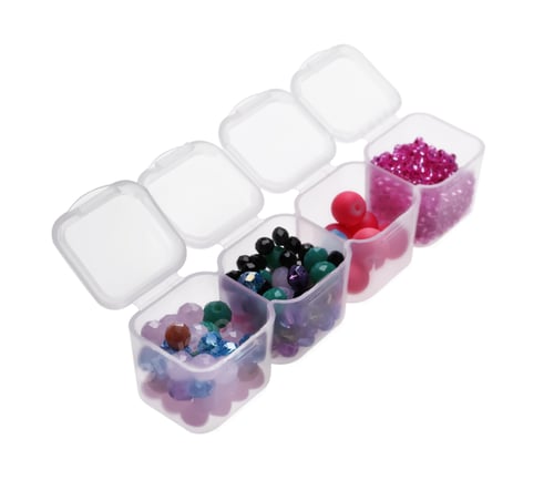 Preview: Plastic organizer with different beads on white background