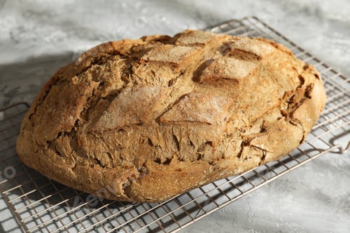 Preview: Freshly baked sourdough bread on grey table