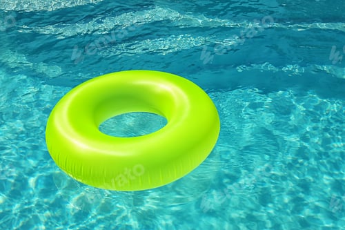 Preview: Bright inflatable ring floating in swimming pool on sunny day. Space for text