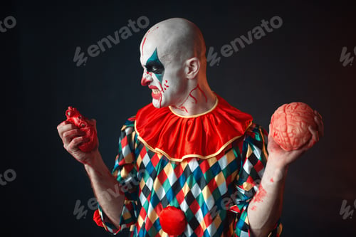 Preview: Mad bloody clown holds human heart and brain